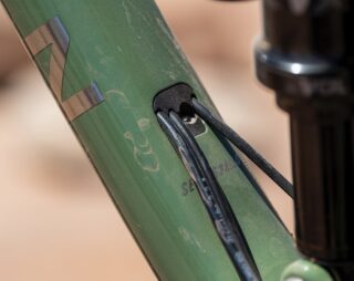 Detail image showing the dropper post cable routing, from the downtube to the seatube